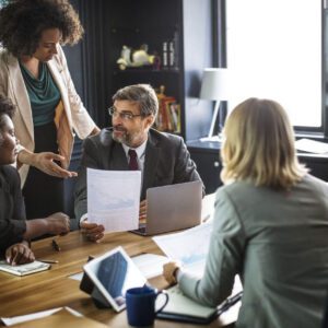 A group of people sitting around a table.