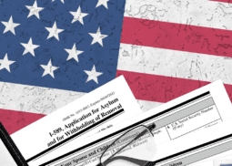 A close up of an american flag with papers and glasses