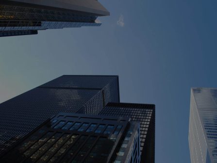 A view of some buildings from below looking up.